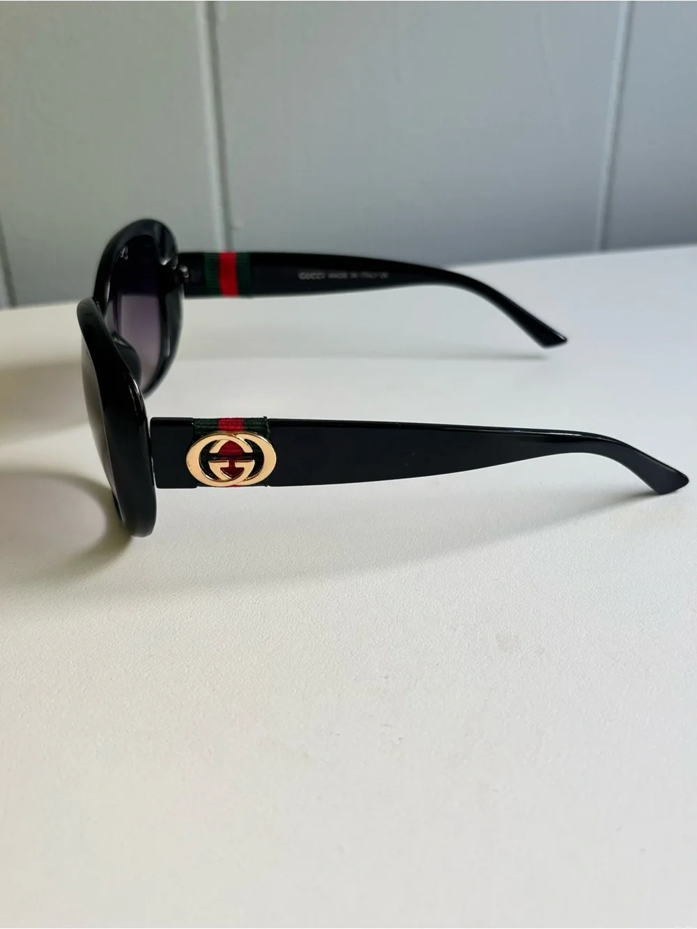 Gucci Black Frame Sunglasses with Purple Gradient Lenses